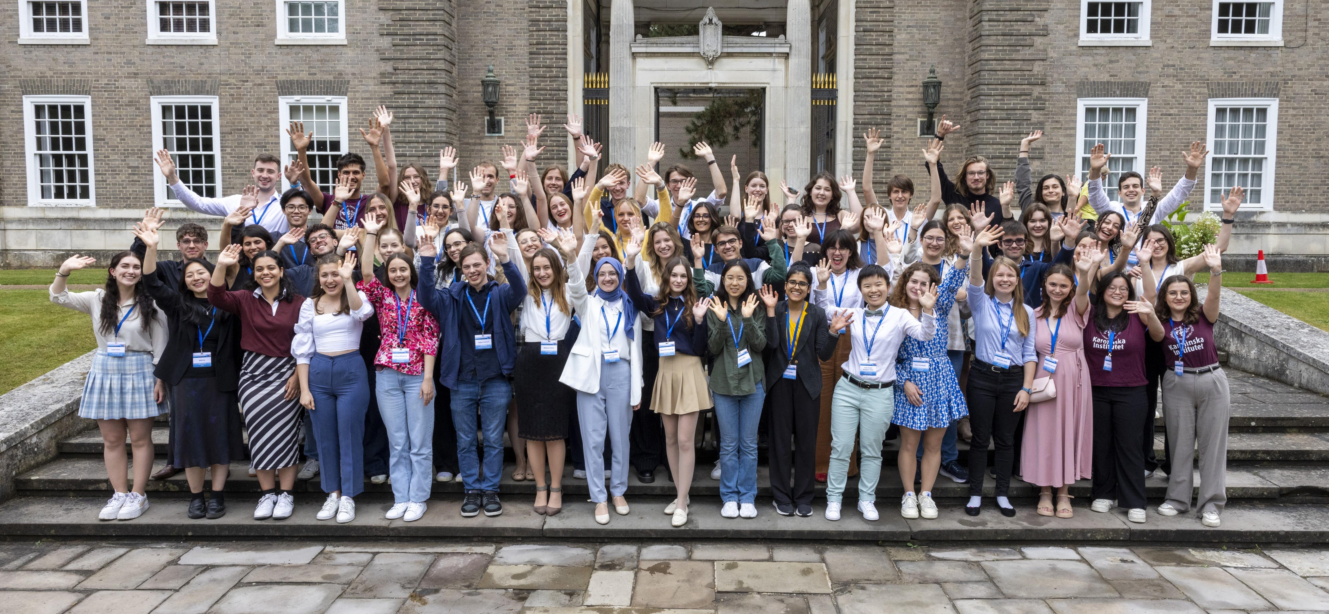 2024 Amgen Scholars waving at the camera